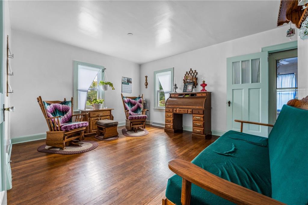 332 Pulaski Road Pulaski, PA 16143 - Photo 20 of 33 a living room with furniture and a fireplace