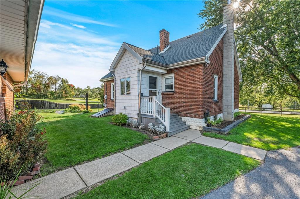 332 Pulaski Road Pulaski, PA 16143 - Photo 2 of 33 a front view of a house with a garden