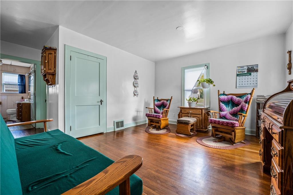 332 Pulaski Road Pulaski, PA 16143 - Photo 21 of 33 a living room with furniture and a wooden floor