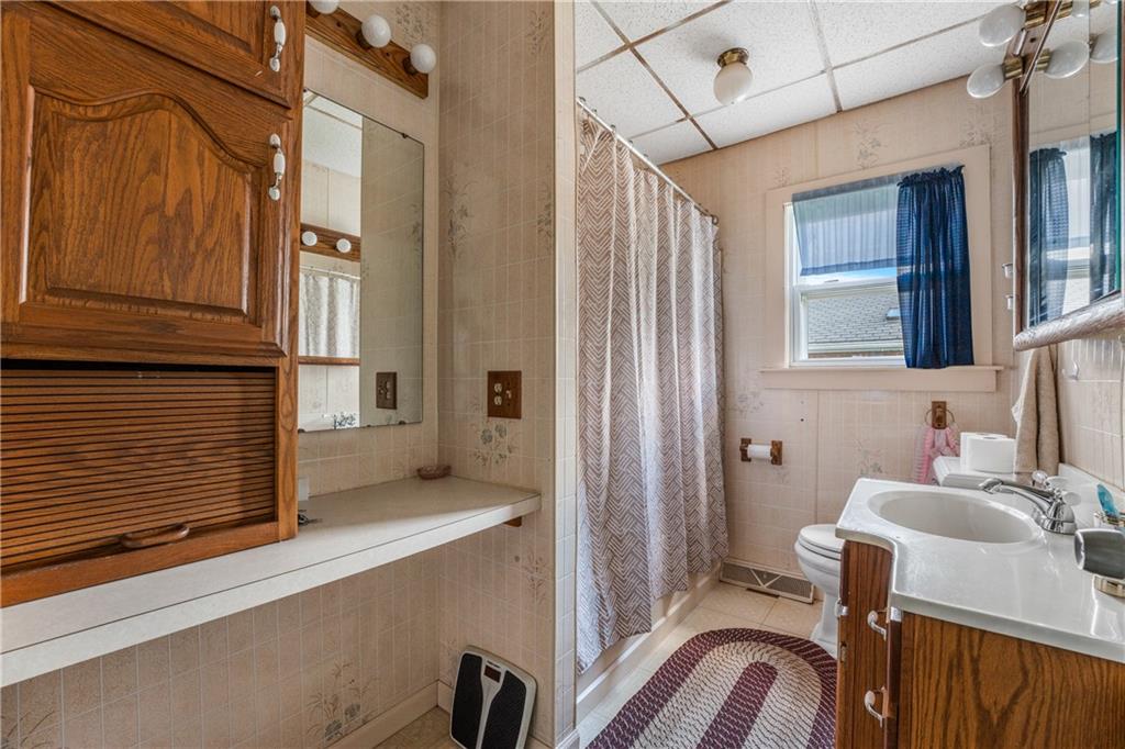 332 Pulaski Road Pulaski, PA 16143 - Photo 22 of 33 a view of a room that has a bed and furniture