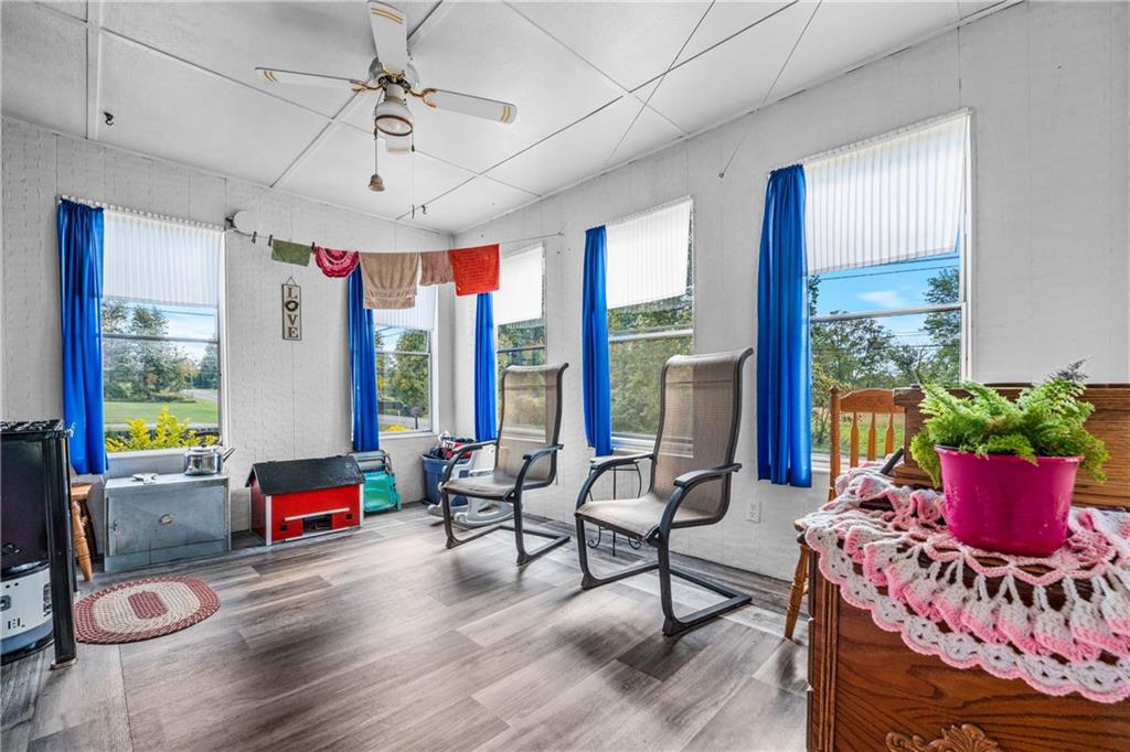 332 Pulaski Road Pulaski, PA 16143 - Photo 23 of 33 a living room with furniture and floor to ceiling windows