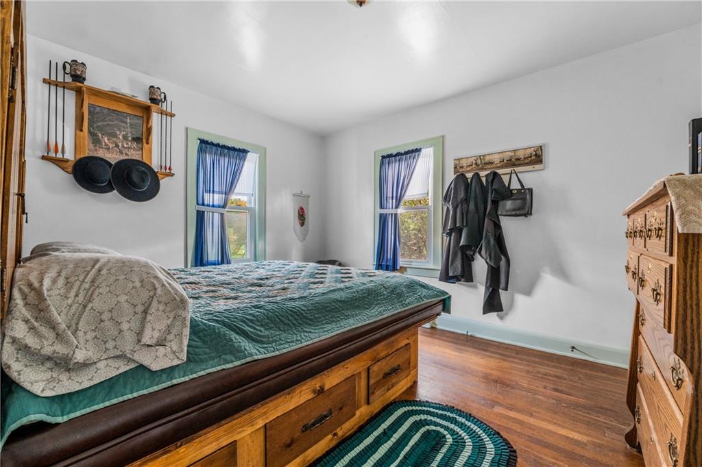 332 Pulaski Road Pulaski, PA 16143 - Photo 25 of 33 a bedroom with a bed and a walk in closet