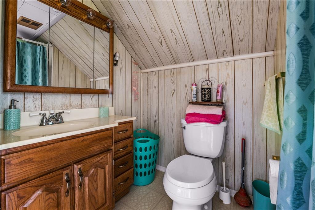 332 Pulaski Road Pulaski, PA 16143 - Photo 27 of 33 a bathroom with a granite countertop toilet sink and mirror