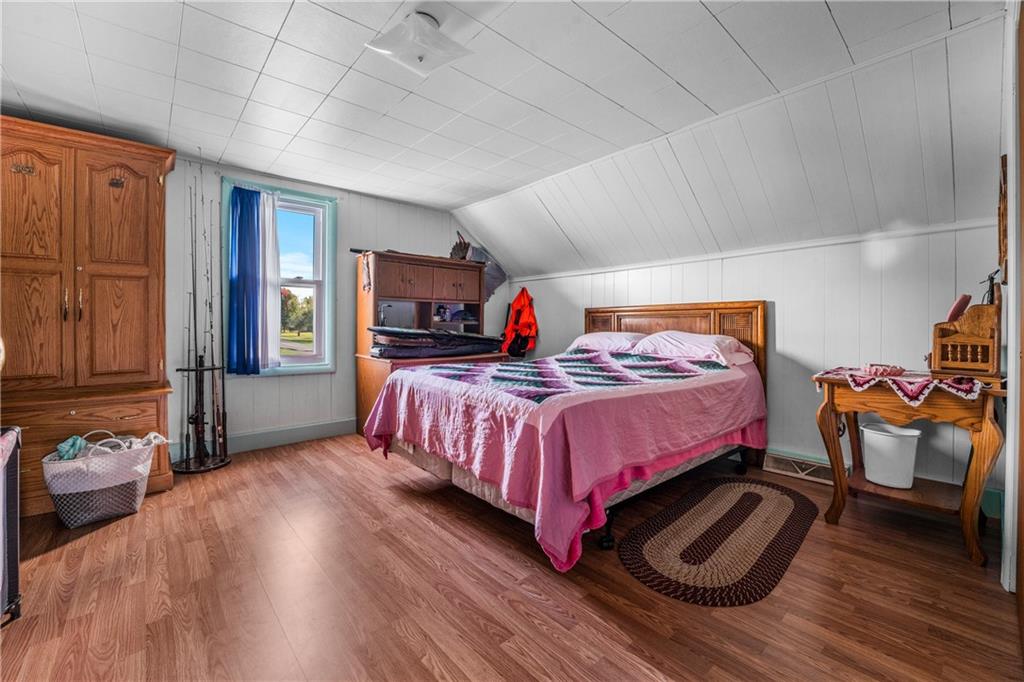 332 Pulaski Road Pulaski, PA 16143 - Photo 28 of 33 a bedroom with a bed and wooden floor