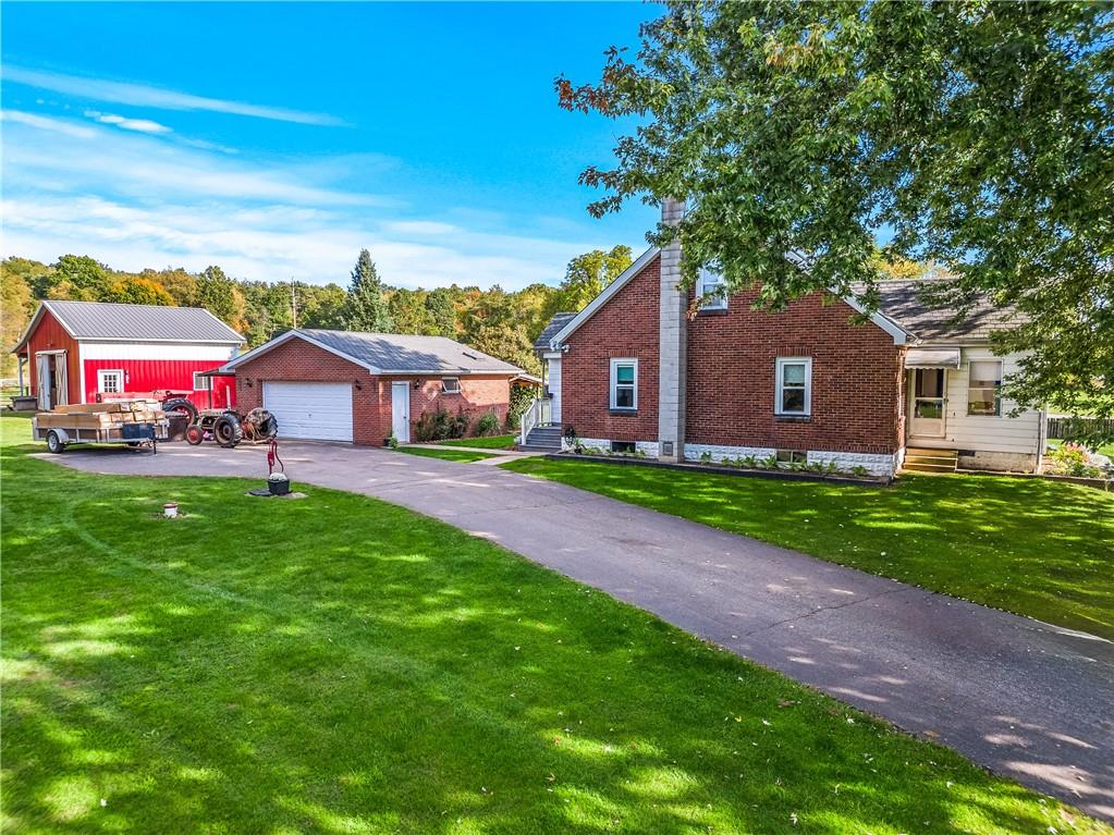332 Pulaski Road Pulaski, PA 16143 - Photo 3 of 33 a front view of house with yard and green space