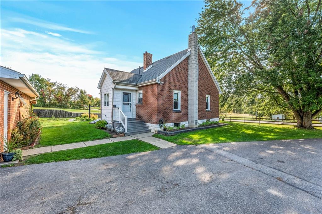 332 Pulaski Road Pulaski, PA 16143 - Photo 4 of 33 a view of a house with a yard and large tree