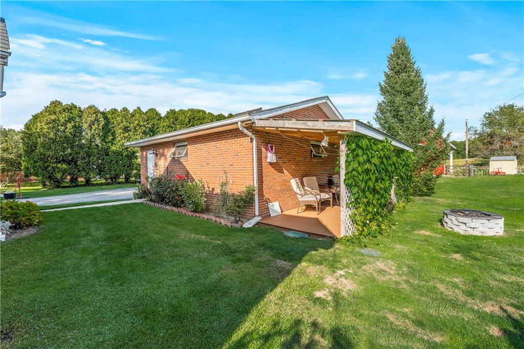 332 Pulaski Road Pulaski, PA 16143 - Photo 5 of 33 a view of a house with backyard and garden