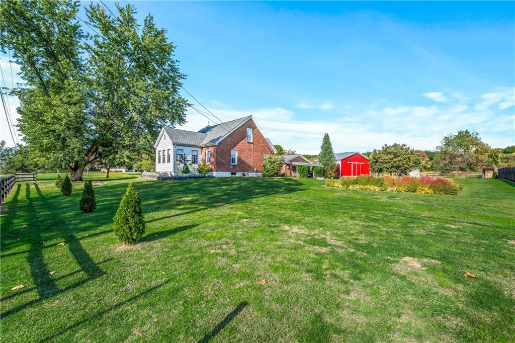 332 Pulaski Road Pulaski, PA 16143 - Photo 6 of 33 a view of a house with a yard and sitting area