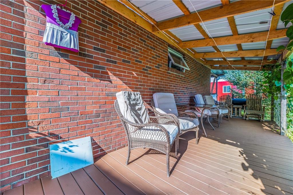 332 Pulaski Road Pulaski, PA 16143 - Photo 7 of 33 a wooden bench sitting in front of a building