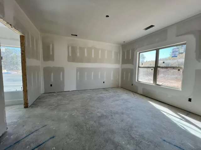 an empty room with windows