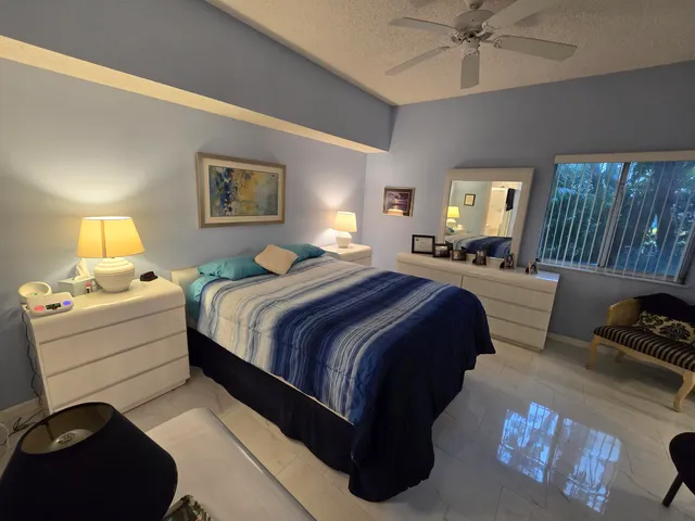 a spacious bedroom with a bed and a couch