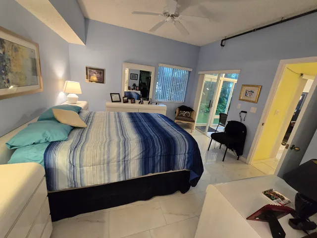a bathroom with a sink a mirror and a glass door shower