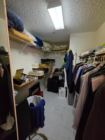 a bathroom with a mirror and a shower