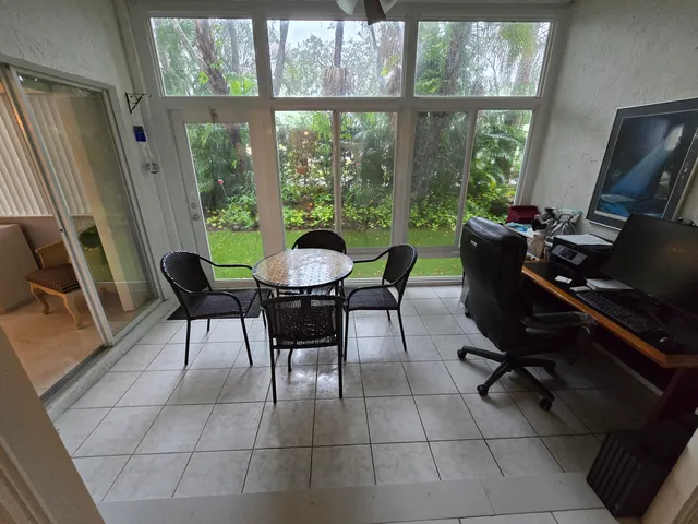 a view of a dining room with furniture window and outside view