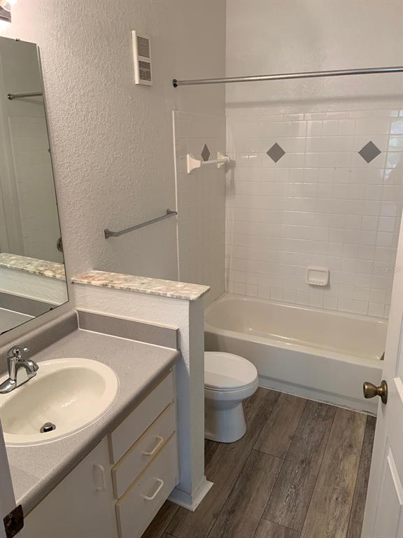 831 Camargo Way, Unit 311 Altamonte Springs, FL 32714 - Photo 13 of 28 a bathroom with a sink toilet a mirror and shower