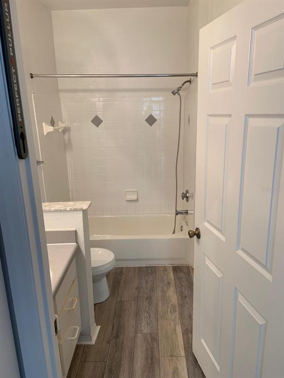 831 Camargo Way, Unit 311 Altamonte Springs, FL 32714 - Photo 14 of 28 a bathroom with a granite countertop shower and a toilet