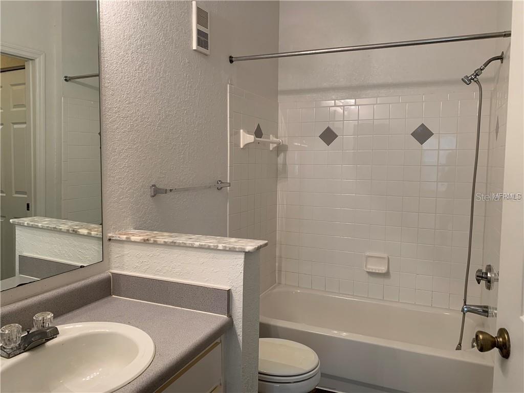 831 Camargo Way, Unit 311 Altamonte Springs, FL 32714 - Photo 15 of 28 a bathroom with a sink toilet and shower