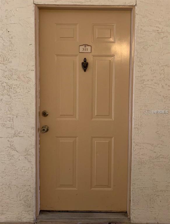 831 Camargo Way, Unit 311 Altamonte Springs, FL 32714 - Photo 2 of 28 a bathroom with a glass door shower
