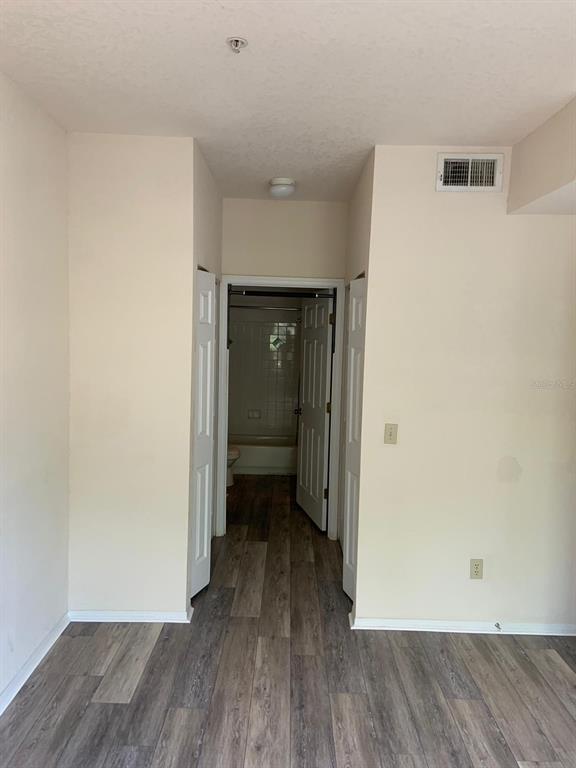 831 Camargo Way, Unit 311 Altamonte Springs, FL 32714 - Photo 8 of 28 wooden floor in an empty room