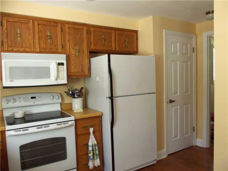 2293 Cramden Road Upper St. Clair, PA 15241 - Photo 8 of 24 Kitchen. Brand new electric stove. Door next to refrigerator is a shallow pantry. Behind this is a door leading out of the house. This pantry could be removed and the door could be used to the walkway of the deck.