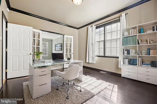 an empty room with a fireplace and a window