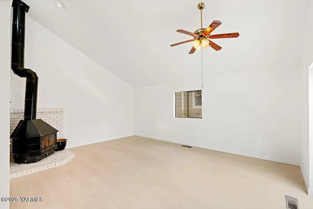 a blue and white vase sitting on a floor