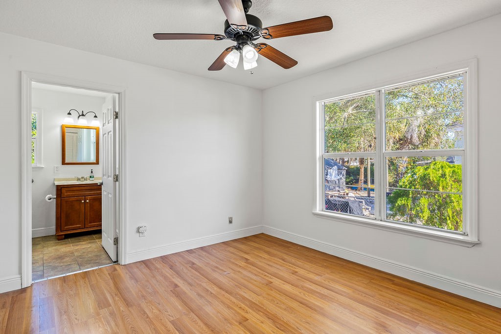 344 13th Place Southwest Vero Beach, FL 32962 - Photo 14 of 30 wooden floor in an empty room with a window