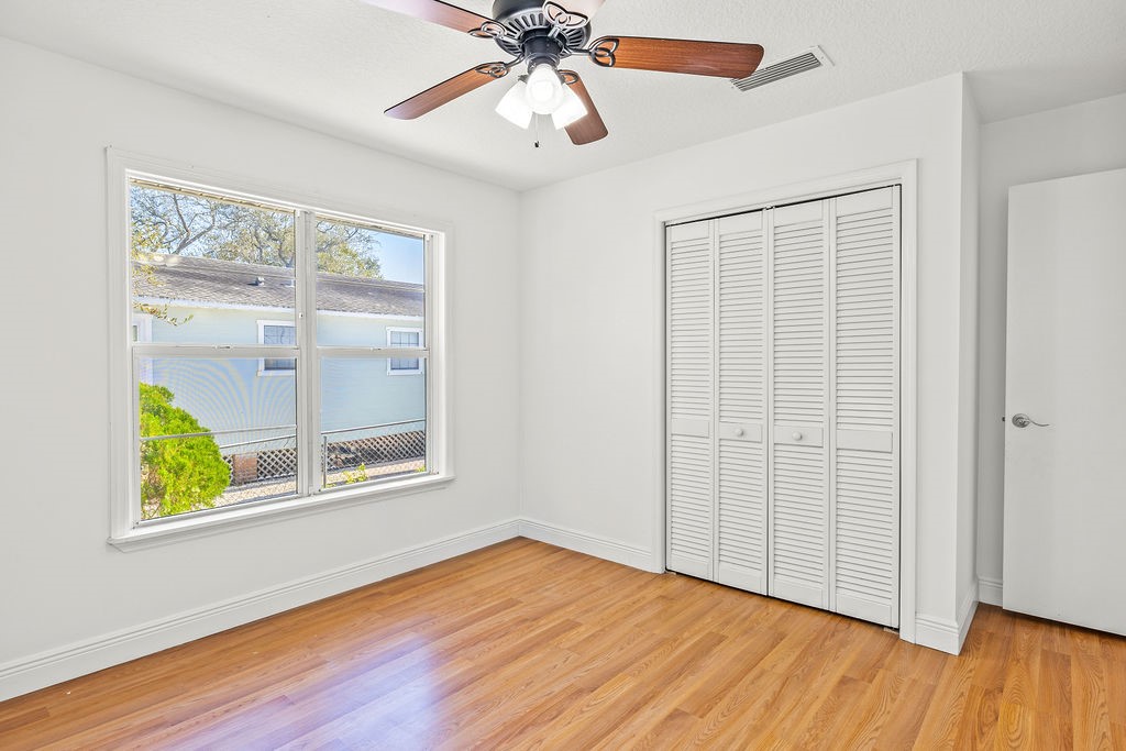 344 13th Place Southwest Vero Beach, FL 32962 - Photo 16 of 30 a view of an empty room with wooden floor and a window