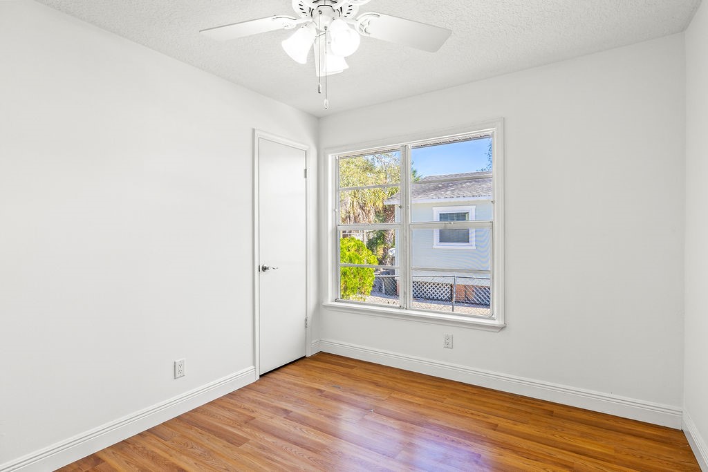 344 13th Place Southwest Vero Beach, FL 32962 - Photo 18 of 30 a view of an empty room with wooden floor and a window