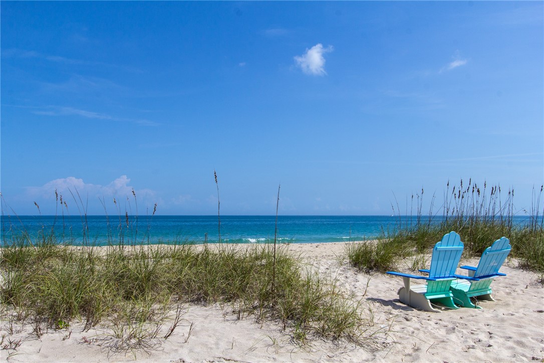 344 13th Place Southwest Vero Beach, FL 32962 - Photo 26 of 30 a view of a backyard with plants and lake view