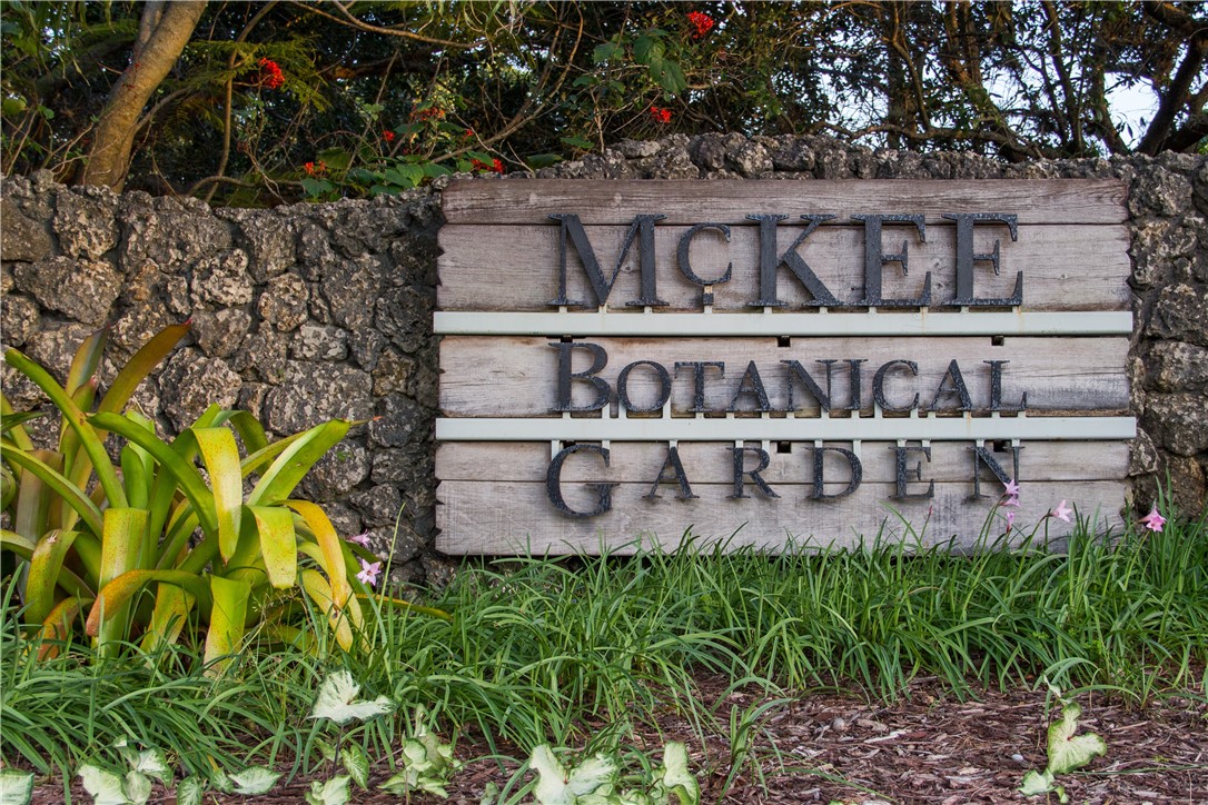 344 13th Place Southwest Vero Beach, FL 32962 - Photo 28 of 30 a view of sign board with plants and brick wall