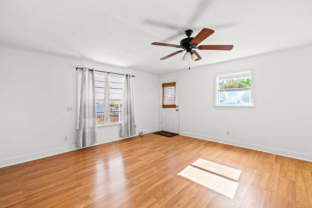344 13th Place Southwest Vero Beach, FL 32962 - Photo 7 of 30 a view of empty room with wooden floor and fan