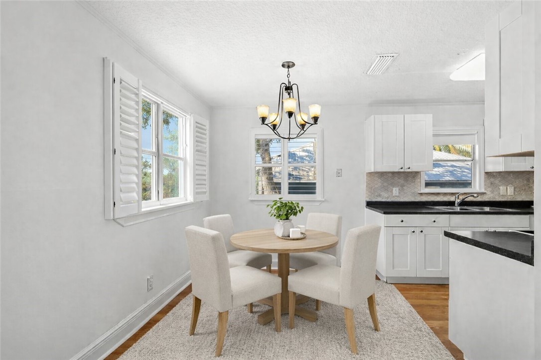 344 13th Place Southwest Vero Beach, FL 32962 - Photo 8 of 30 a kitchen with a table and chairs in it