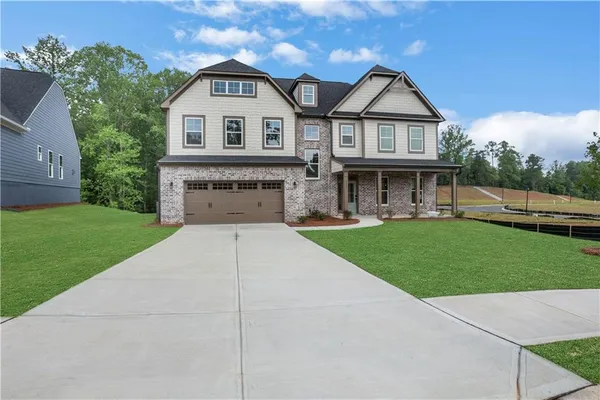front view of a house with a yard