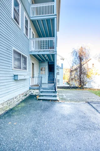 a view of a house with wooden floor and fence
