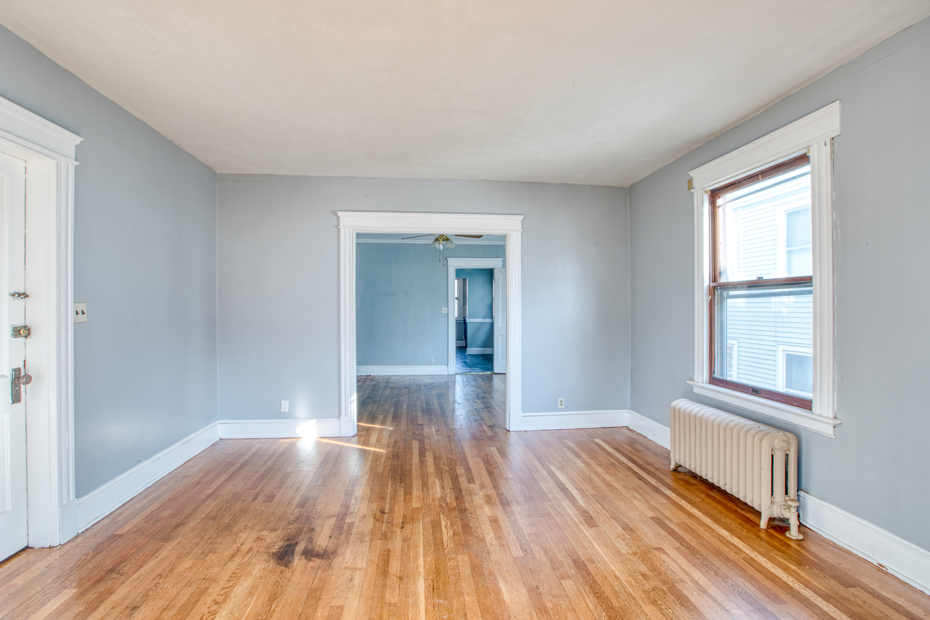 226 Ledgeside Avenue, Unit 228 Waterbury, CT 06708 - Photo 7 of 19 a view of empty room with wooden floor and fan