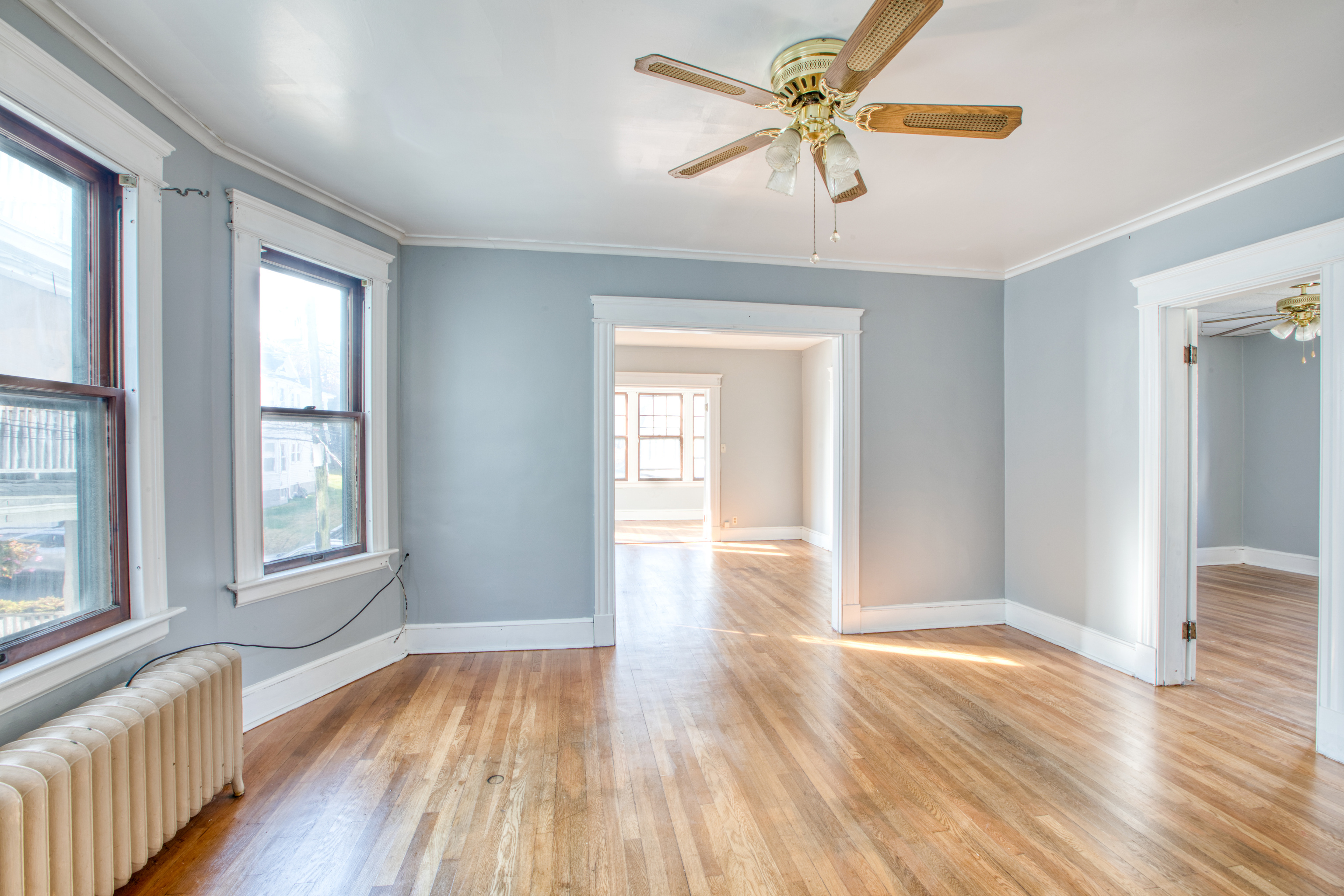 226 Ledgeside Avenue, Unit 228 Waterbury, CT 06708 - Photo 8 of 19 a view of an empty room with window and wooden floor