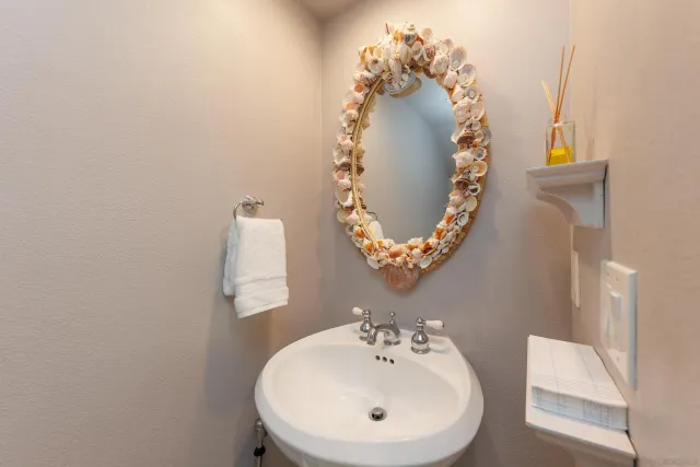 a bathroom with a sink and mirror
