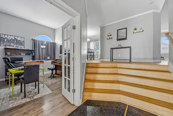 a view of living room with furniture and wooden floor