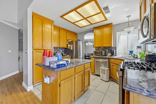 a kitchen with a sink and a refrigerator