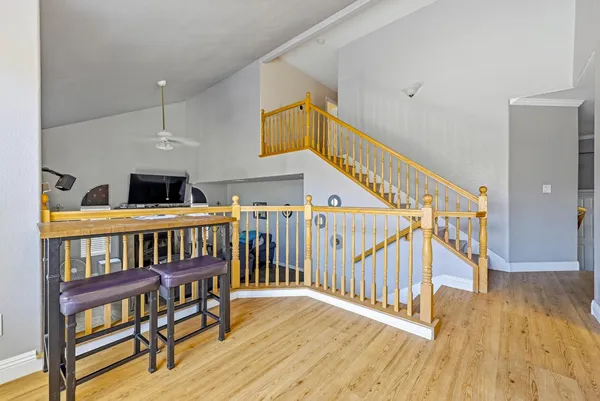 a bedroom with furniture and a wooden floor