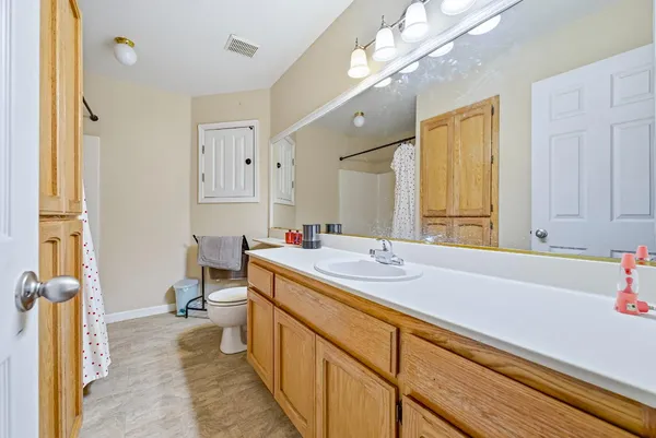 a bathroom with a sink a vanity and a mirror