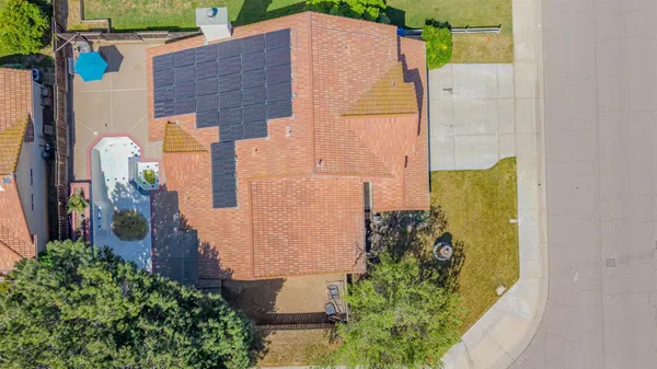 an aerial view of a house with outdoor space