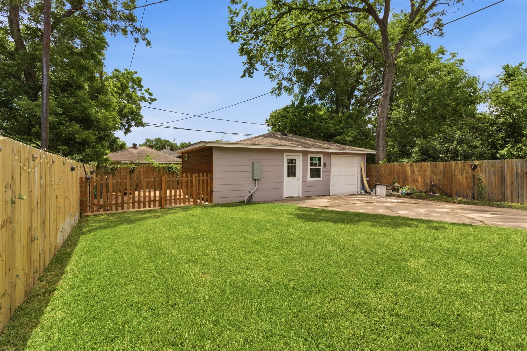 306 Center Street Pasadena, TX 77506 - Photo 21 of 31 a view of a house with a yard and a garden