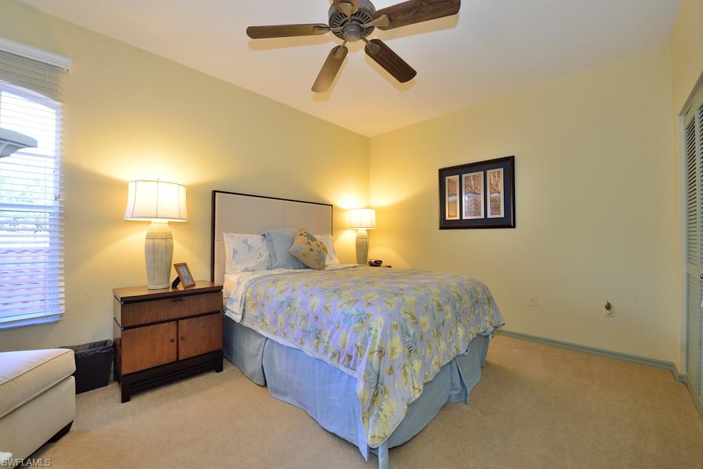 8125 Celeste Drive, Unit 5216 Naples, FL 34113 - Photo 11 of 11 a bedroom with a bed and window