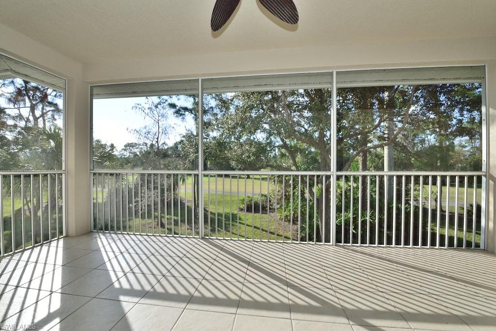 8125 Celeste Drive, Unit 5216 Naples, FL 34113 - Photo 3 of 11 a view of a balcony with wooden floor