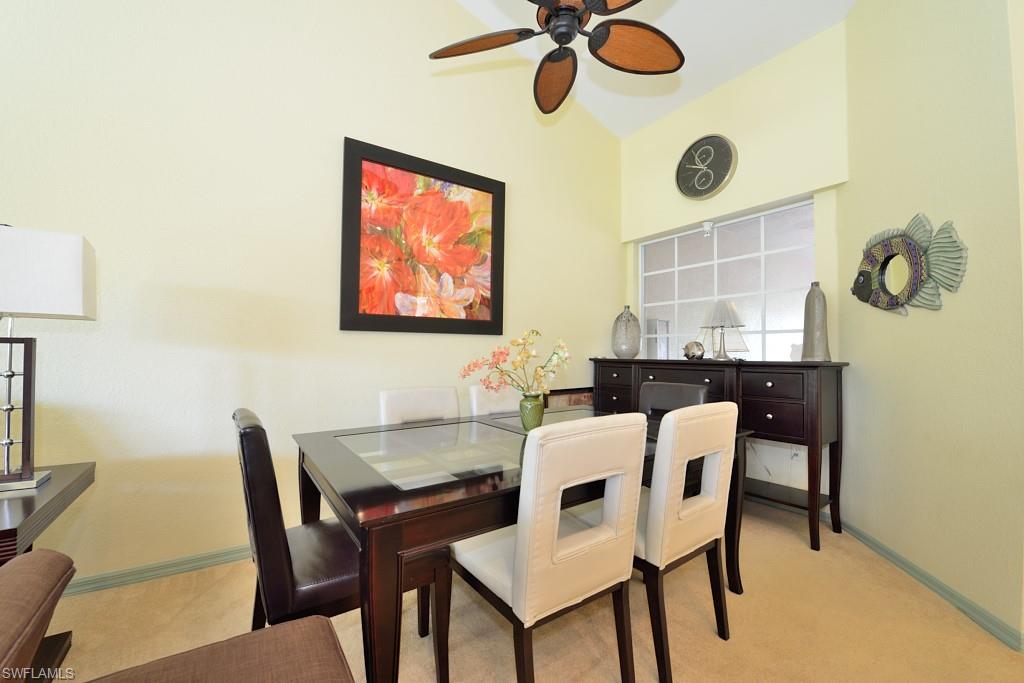 8125 Celeste Drive, Unit 5216 Naples, FL 34113 - Photo 4 of 11 a dining room with furniture and window