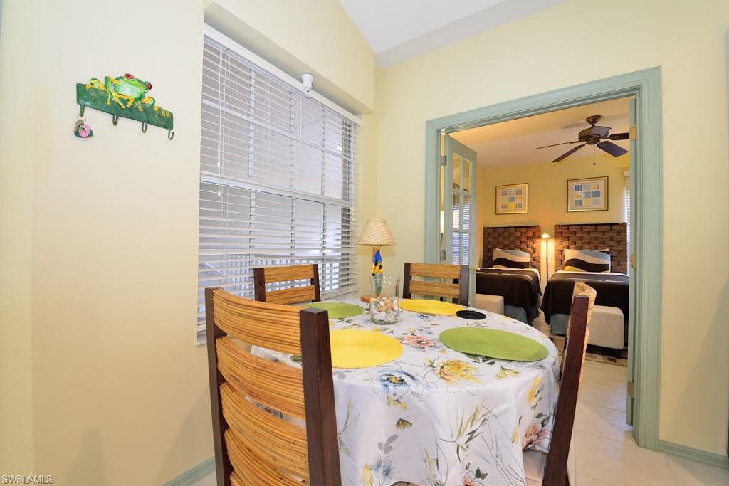 8125 Celeste Drive, Unit 5216 Naples, FL 34113 - Photo 6 of 11 a living room with furniture and a fireplace