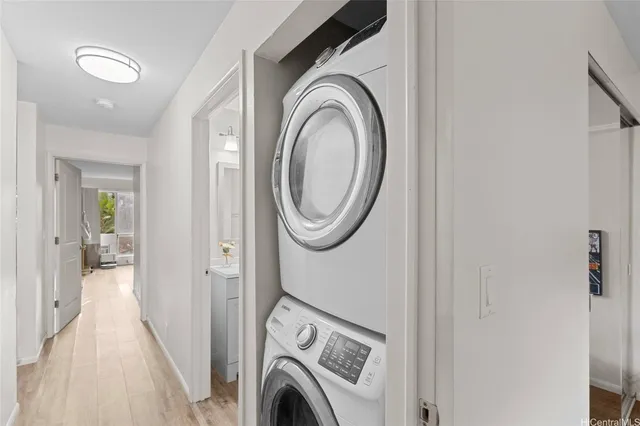 a view of a hallway with washer and dryer