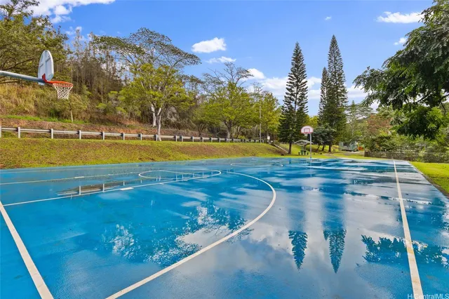 a view of a swimming pool with an outdoor space and seating area